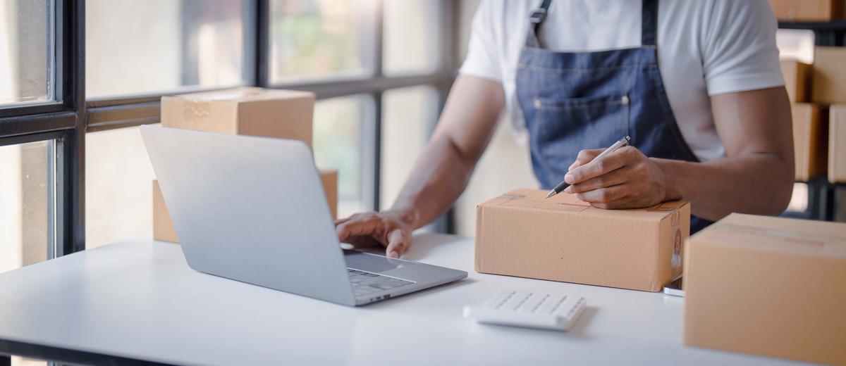 Online shopping young start small business in a cardboard box at work. The seller prepares the delivery box for the customer online sales or ecommerce