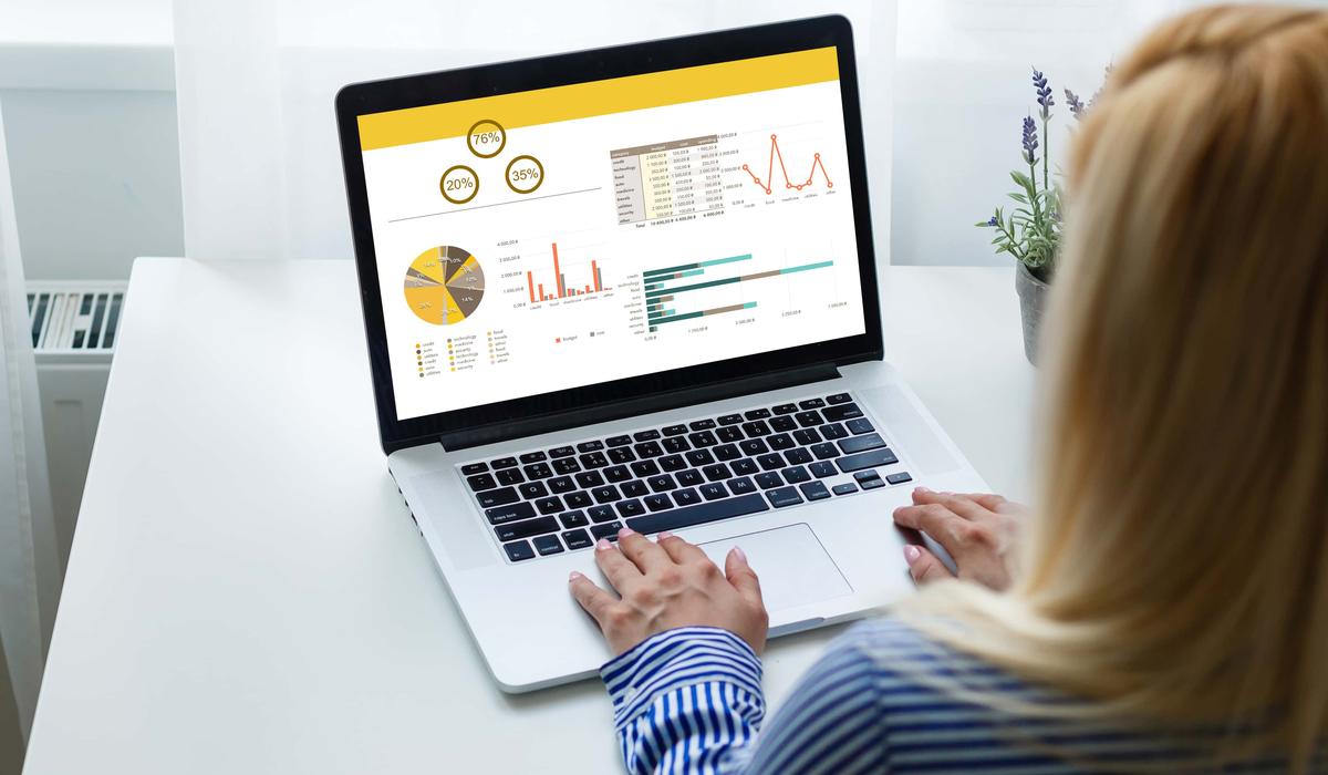 laptop on table showing charts and graph analysis business accounting statistics concept