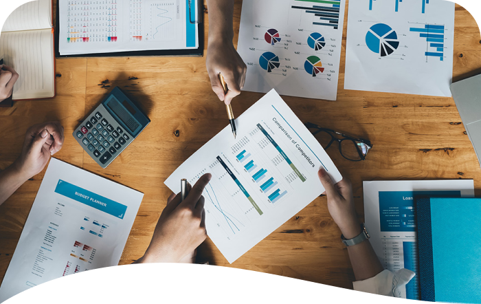a table with charts and other financial documents